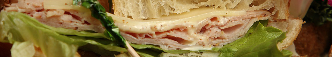 Eating Deli Sandwich at Suzy Deli restaurant in Reston, VA.